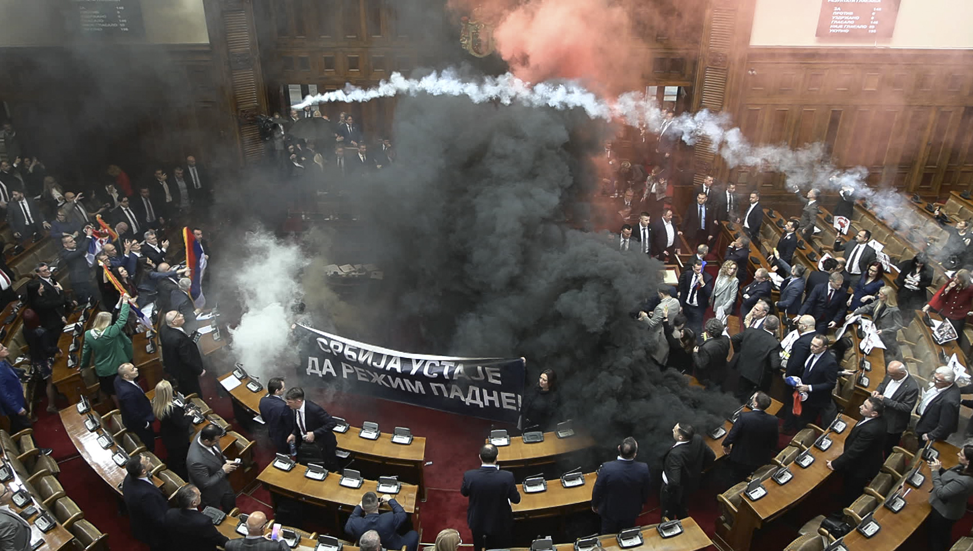 Serbian PM quits in smoke-filled national assembly