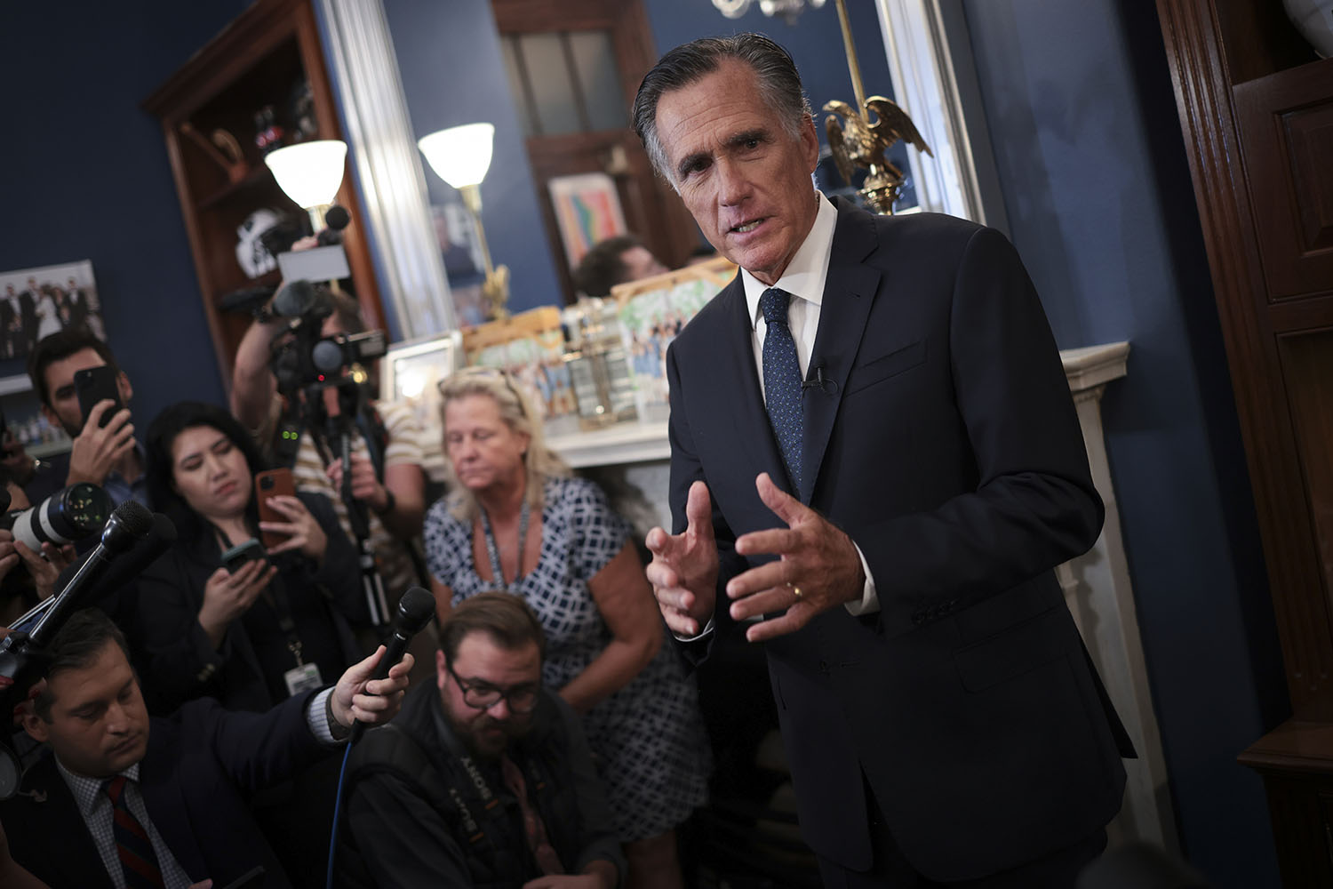 Romney stands down
