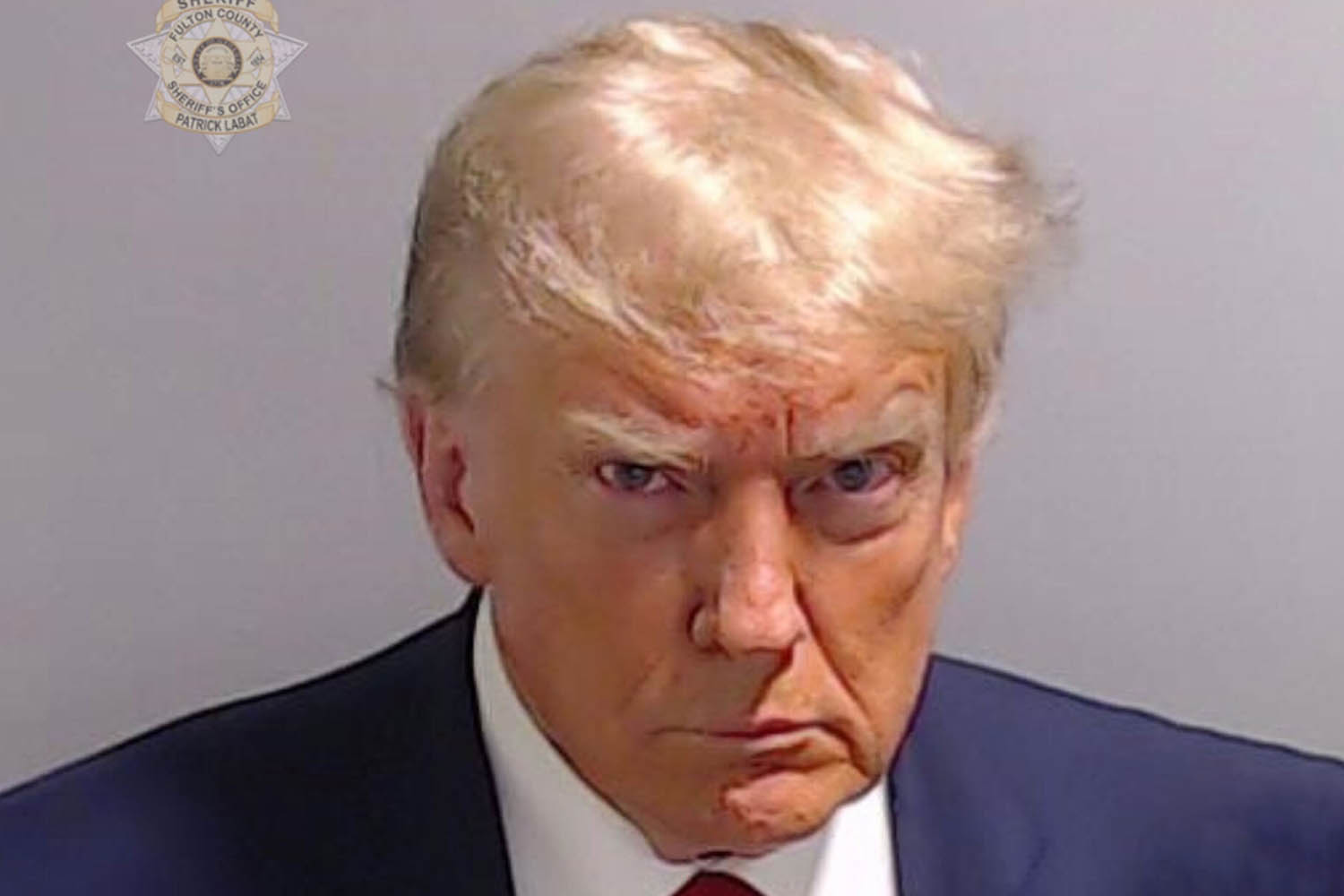 Trump surrenders