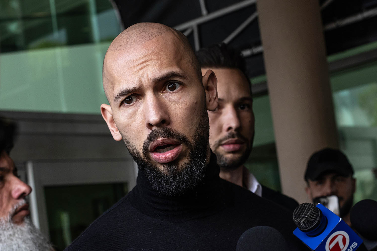 Lifted travel ban lets Tate brothers escape